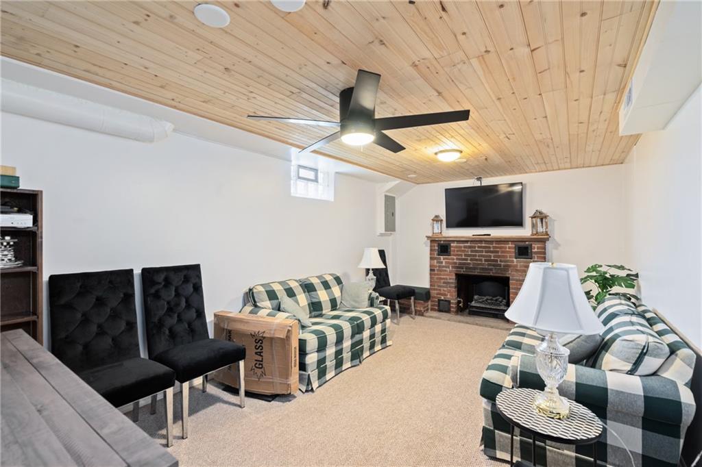 594 Whitestown Road Butler, PA 16001 - Photo 3 of 25 a living room with furniture and a fireplace