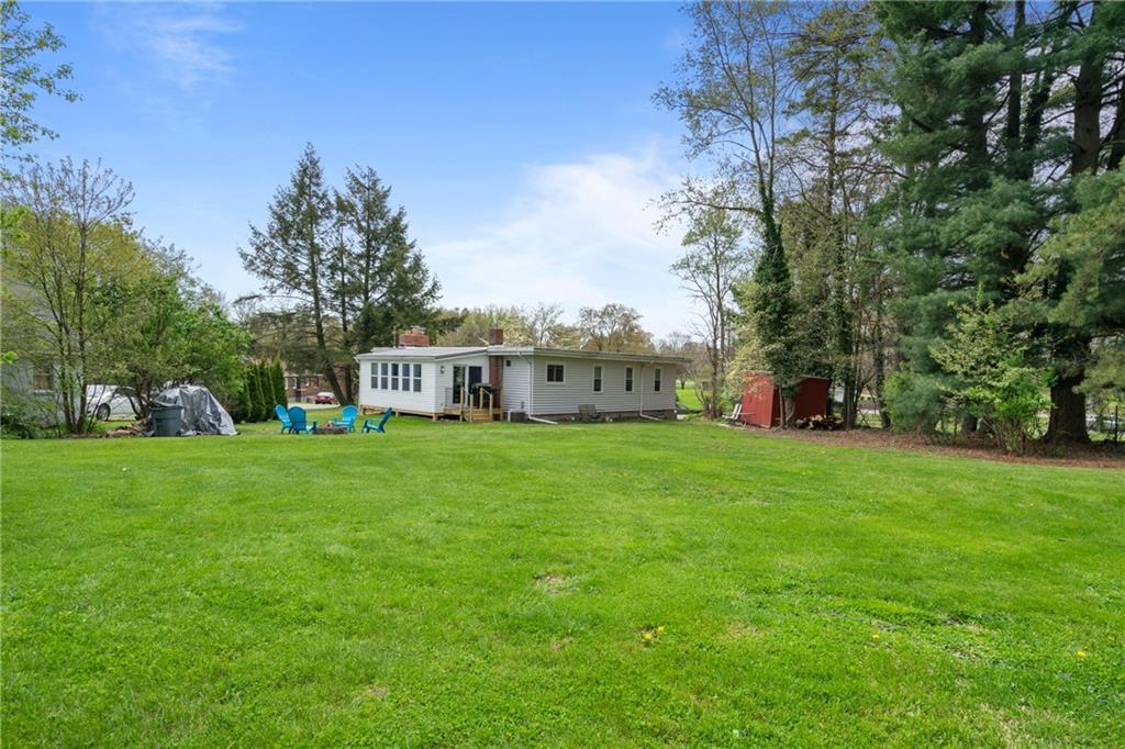 594 Whitestown Road Butler, PA 16001 - Photo 5 of 25 a view of a white house in front of a big yard with large trees
