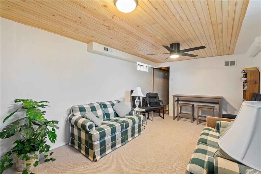 594 Whitestown Road Butler, PA 16001 - Photo 6 of 25 a living room with furniture and a potted plant