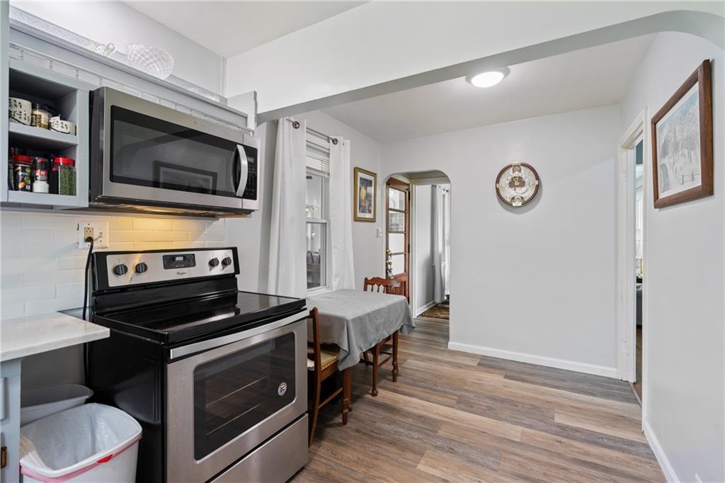 594 Whitestown Road Butler, PA 16001 - Photo 7 of 25 a kitchen with a stove and a microwave