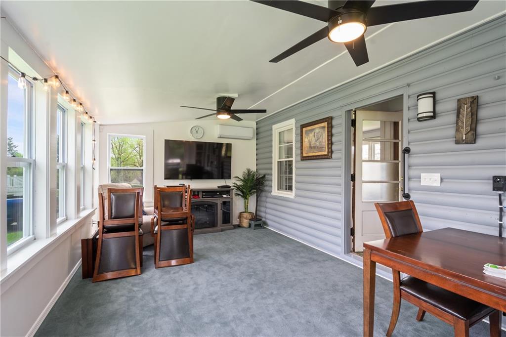 594 Whitestown Road Butler, PA 16001 - Photo 9 of 25 a living room with furniture and a flat screen tv