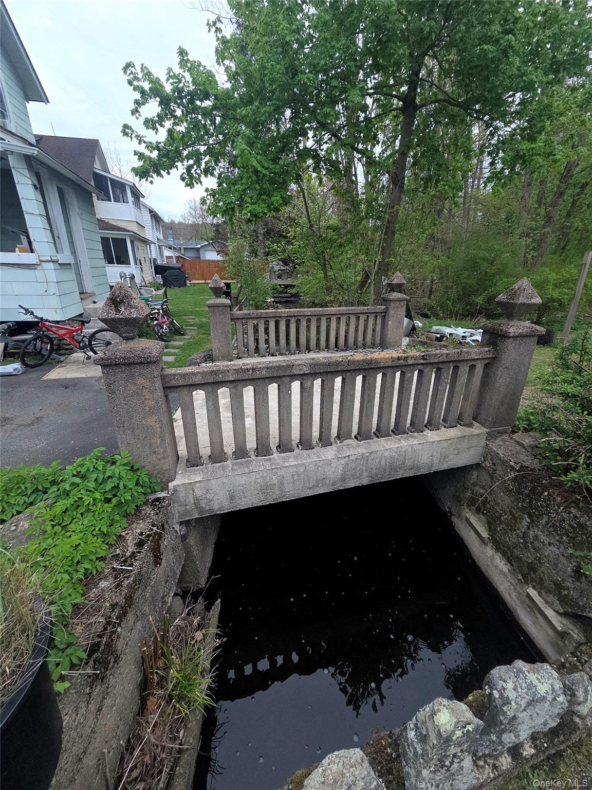 11 Eagle Valley Road, Unit 7 Sloatsburg, NY 10974 - Photo 11 of 24 a view of a chair and table in the backyard