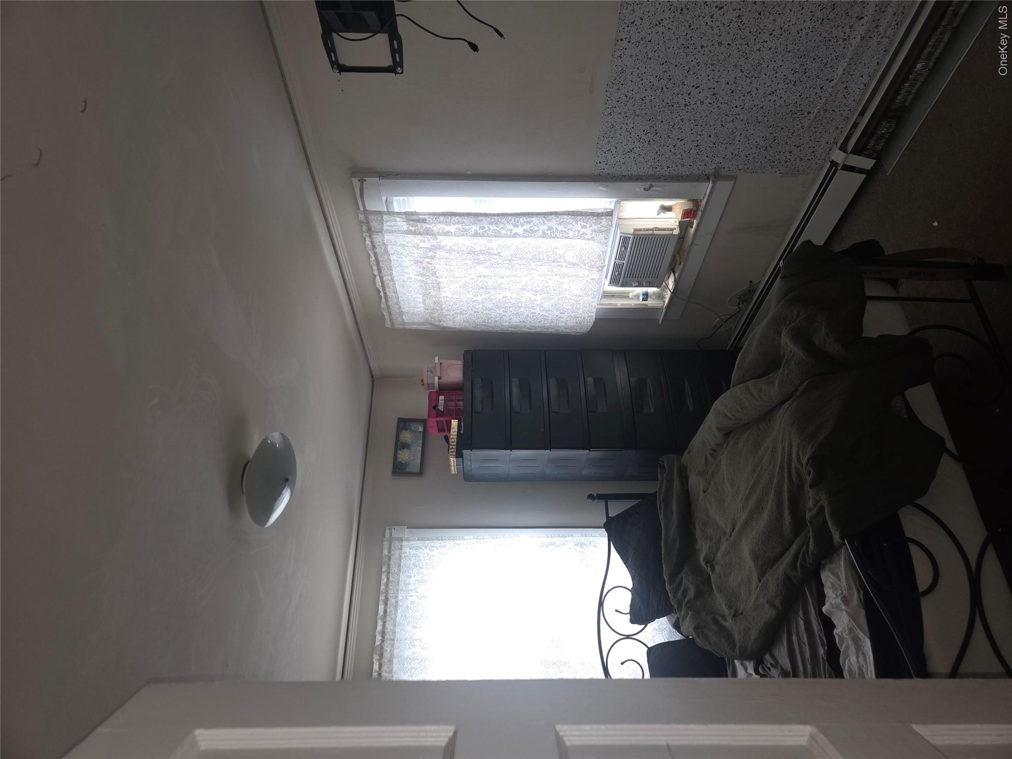 11 Eagle Valley Road, Unit 7 Sloatsburg, NY 10974 - Photo 16 of 24 a bedroom with a bed and a window