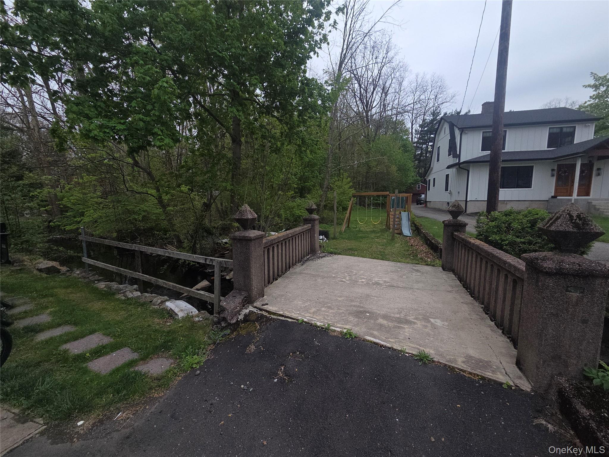11 Eagle Valley Road, Unit 7 Sloatsburg, NY 10974 - Photo 18 of 24 a view of a street with a bench in front of it