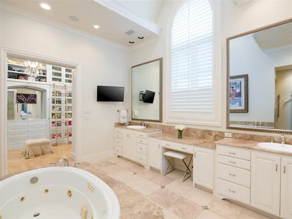 a bathroom with a bathtub sink and mirror