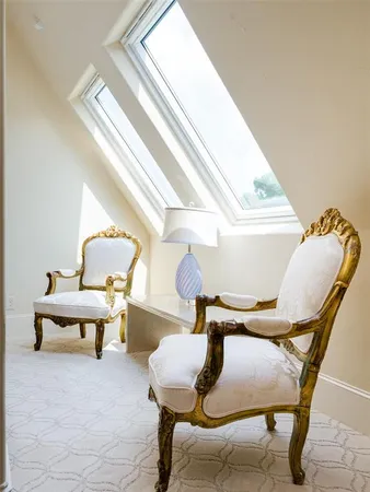 a reading room with furniture and wooden floor