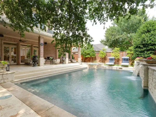 front view of a house with a swimming pool