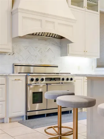 a kitchen with a stove and a refrigerator