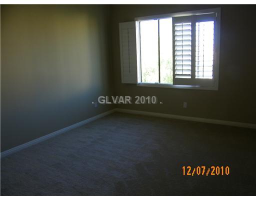 9024 Rusty Rifle Avenue Las Vegas, NV 89143 - Photo 7 of 10 Master Bedroom.