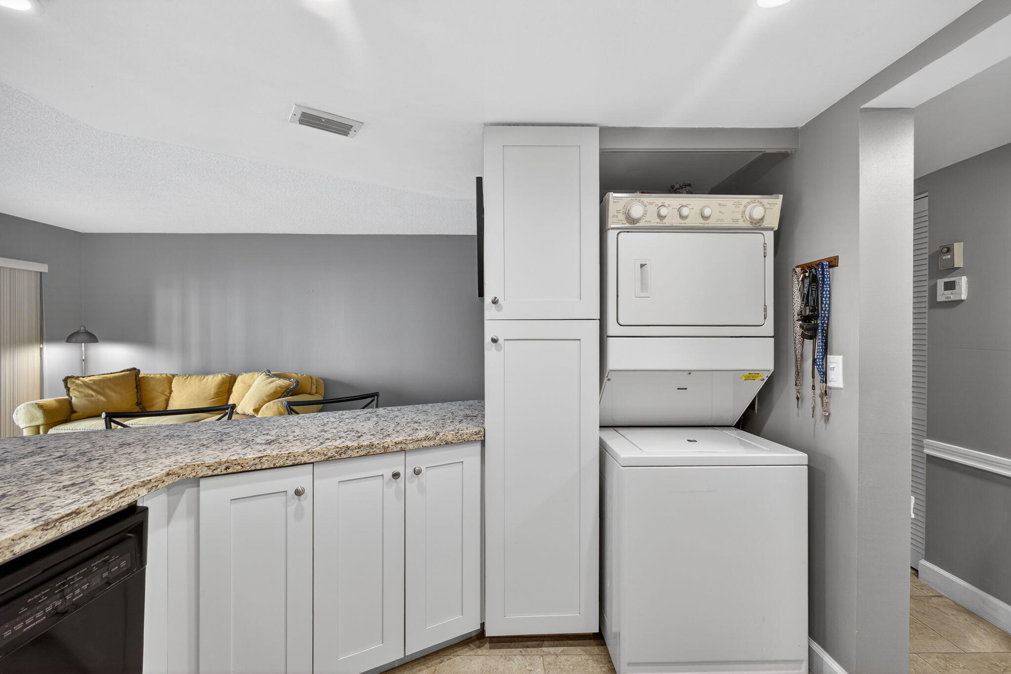 1605 Highway 1, Unit D105 Jupiter, FL 33477 - Photo 11 of 69 a utility room with dryer and washer