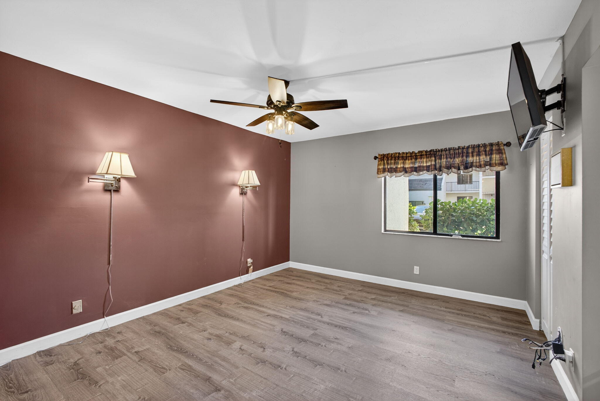 1605 Highway 1, Unit D105 Jupiter, FL 33477 - Photo 13 of 69 a view of room with window and ceiling fan