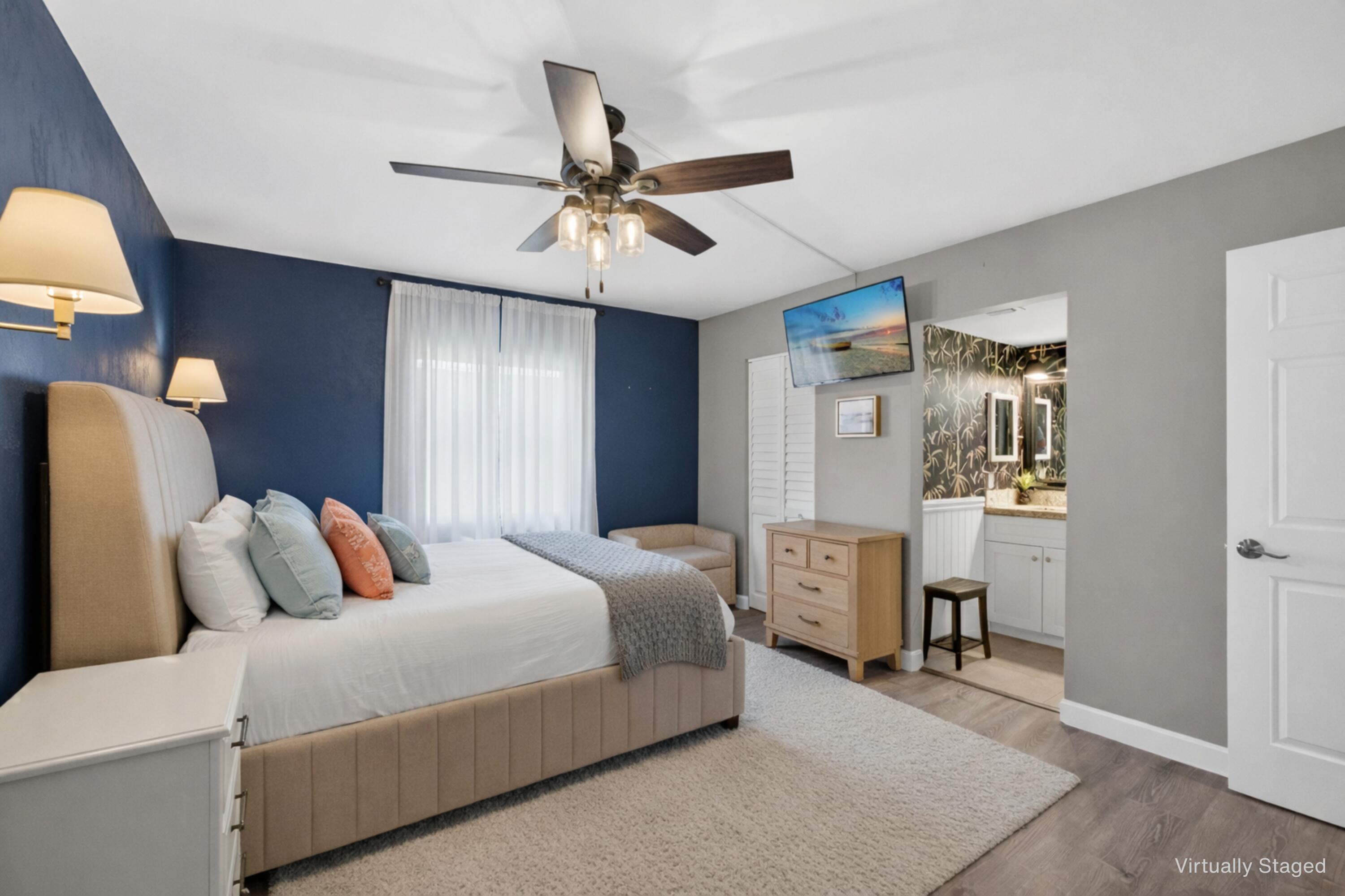 1605 Highway 1, Unit D105 Jupiter, FL 33477 - Photo 14 of 69 a bedroom with bed and window