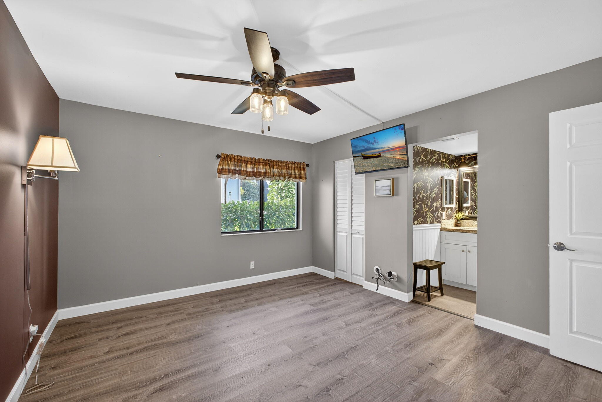 1605 Highway 1, Unit D105 Jupiter, FL 33477 - Photo 15 of 69 wooden floor in an empty room with a window