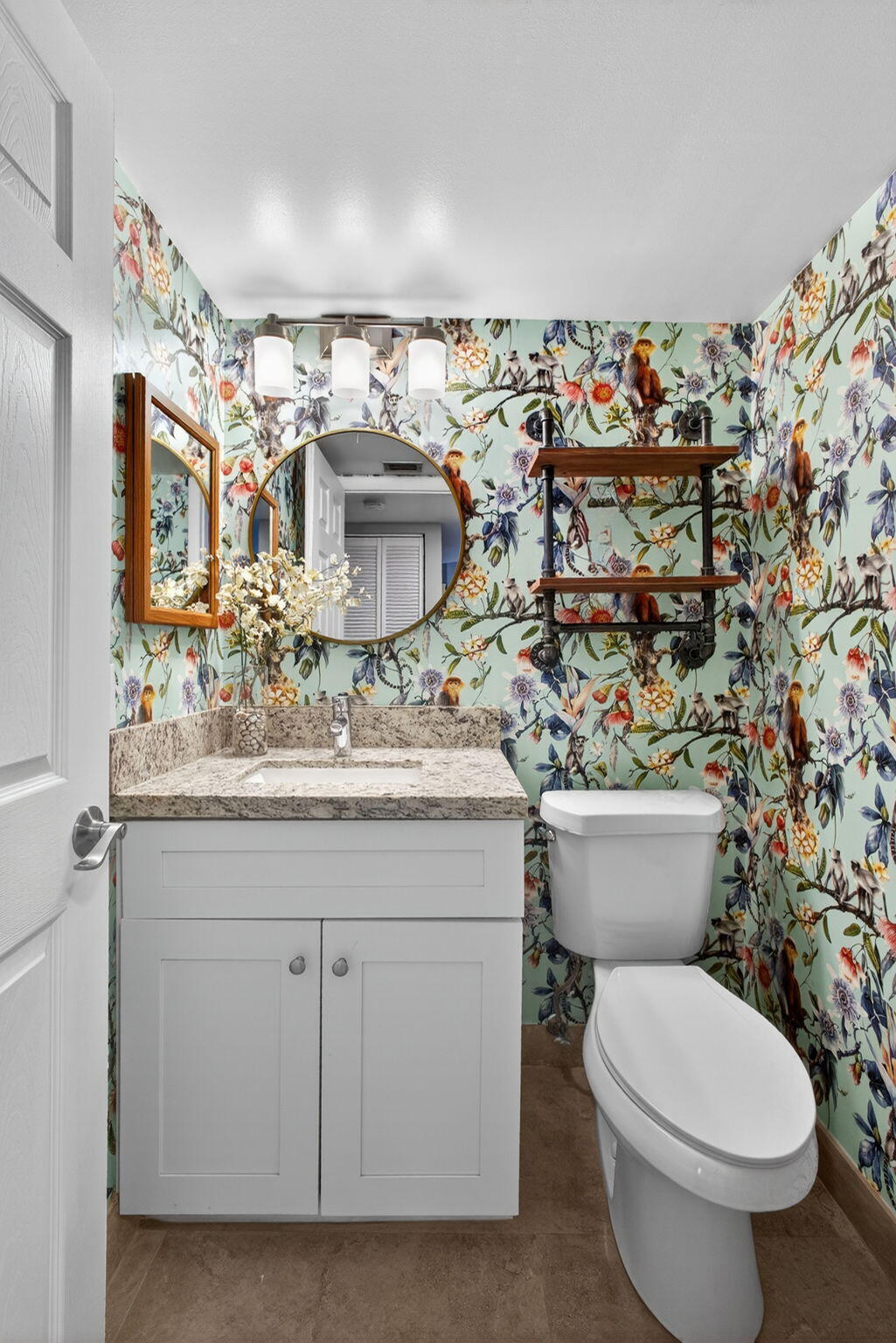 1605 Highway 1, Unit D105 Jupiter, FL 33477 - Photo 17 of 69 a bathroom with a toilet sink and mirror