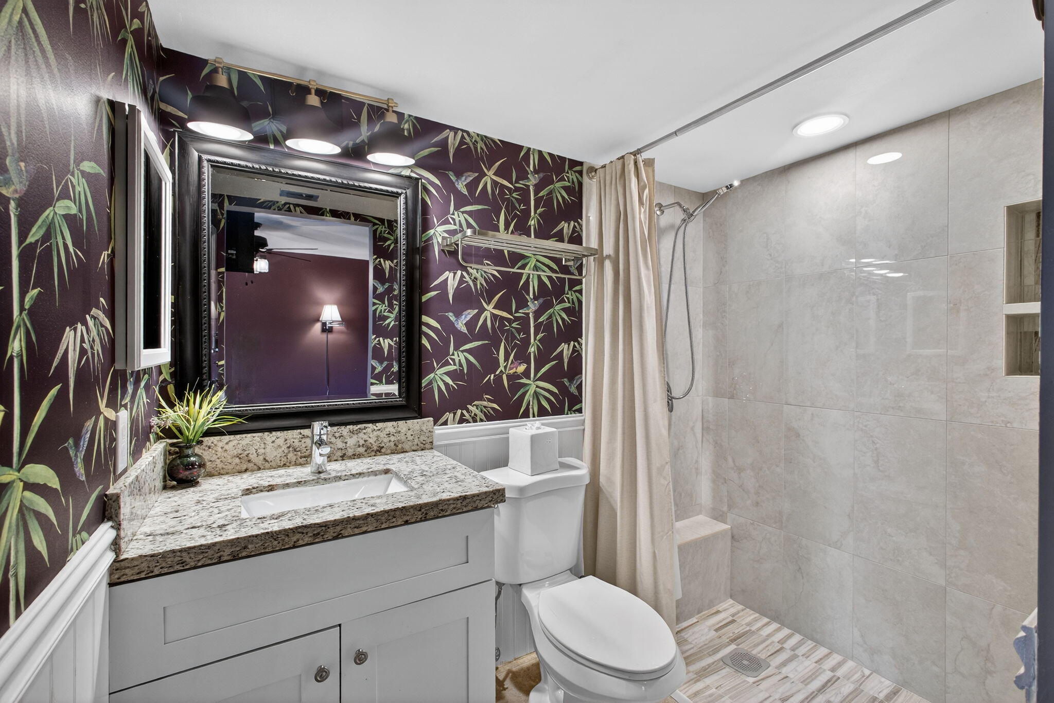 1605 Highway 1, Unit D105 Jupiter, FL 33477 - Photo 19 of 69 a bathroom with a granite countertop sink toilet and shower