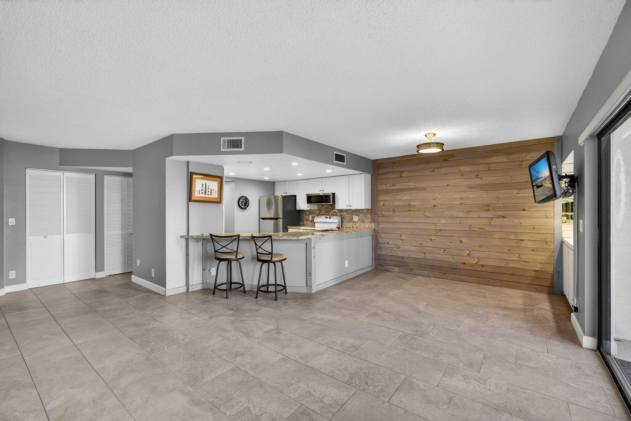 1605 Highway 1, Unit D105 Jupiter, FL 33477 - Photo 24 of 69 a view of kitchen with furniture and refrigerator