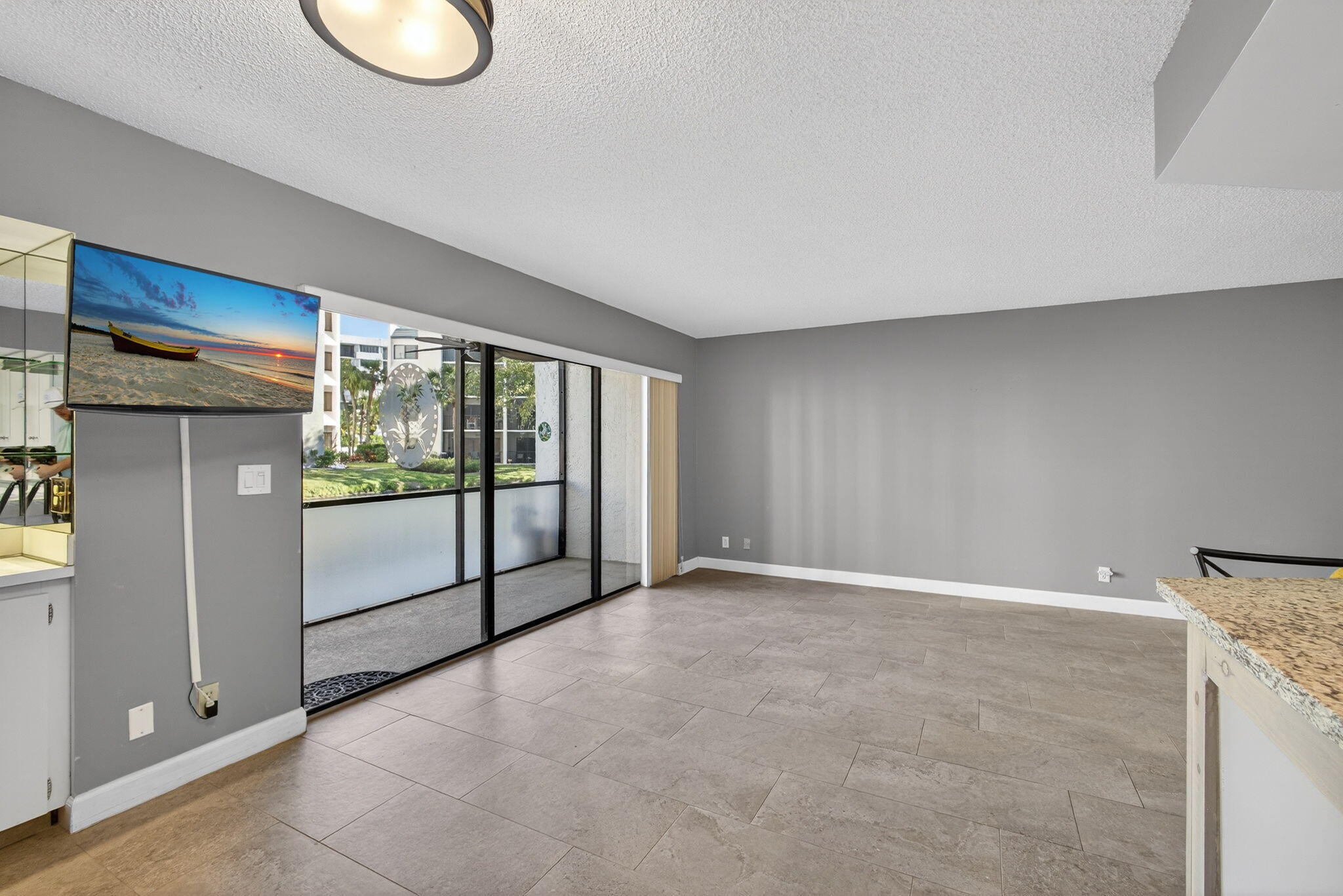 1605 Highway 1, Unit D105 Jupiter, FL 33477 - Photo 26 of 69 a view of an empty room with a window