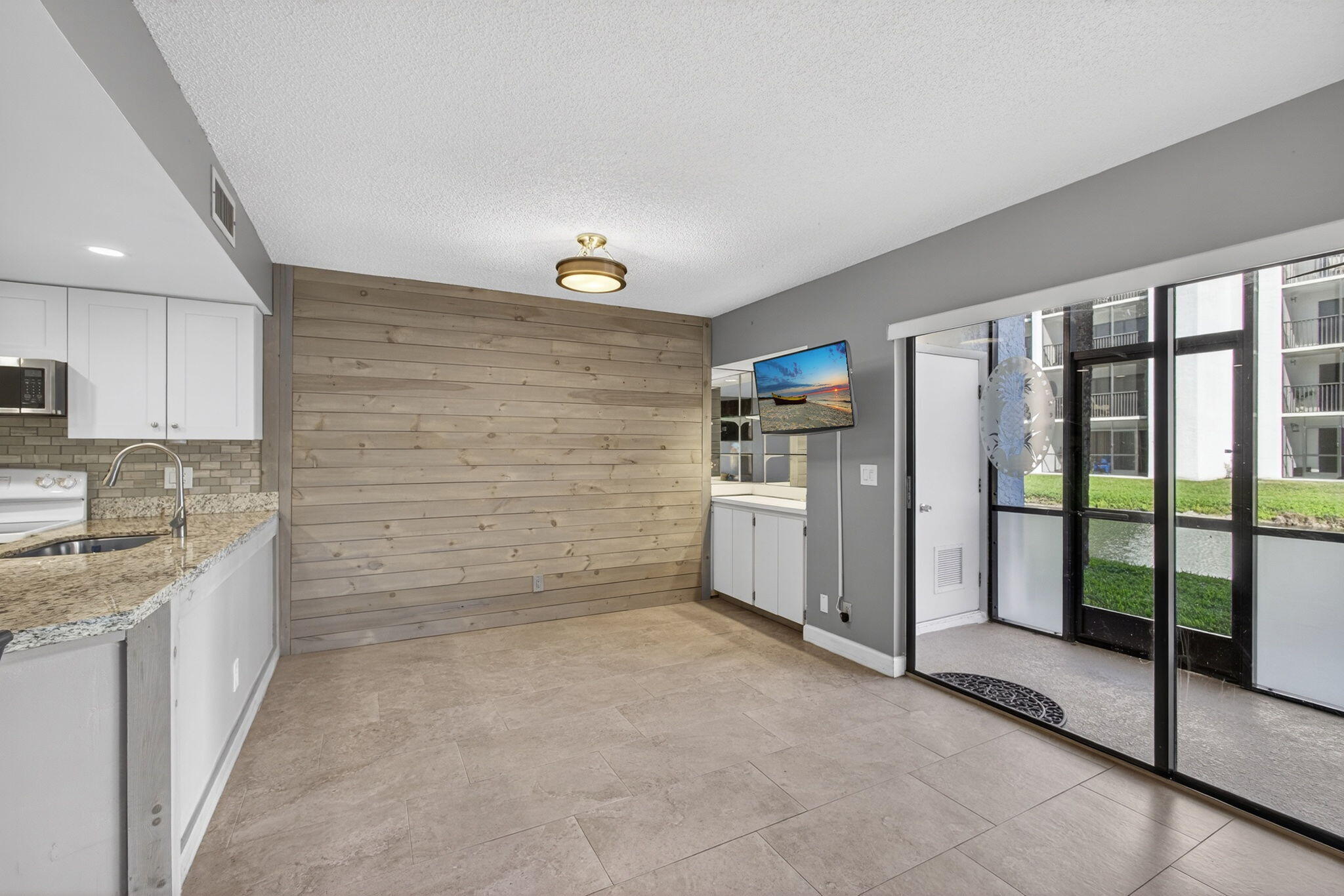 1605 Highway 1, Unit D105 Jupiter, FL 33477 - Photo 28 of 69 living Room / Patio