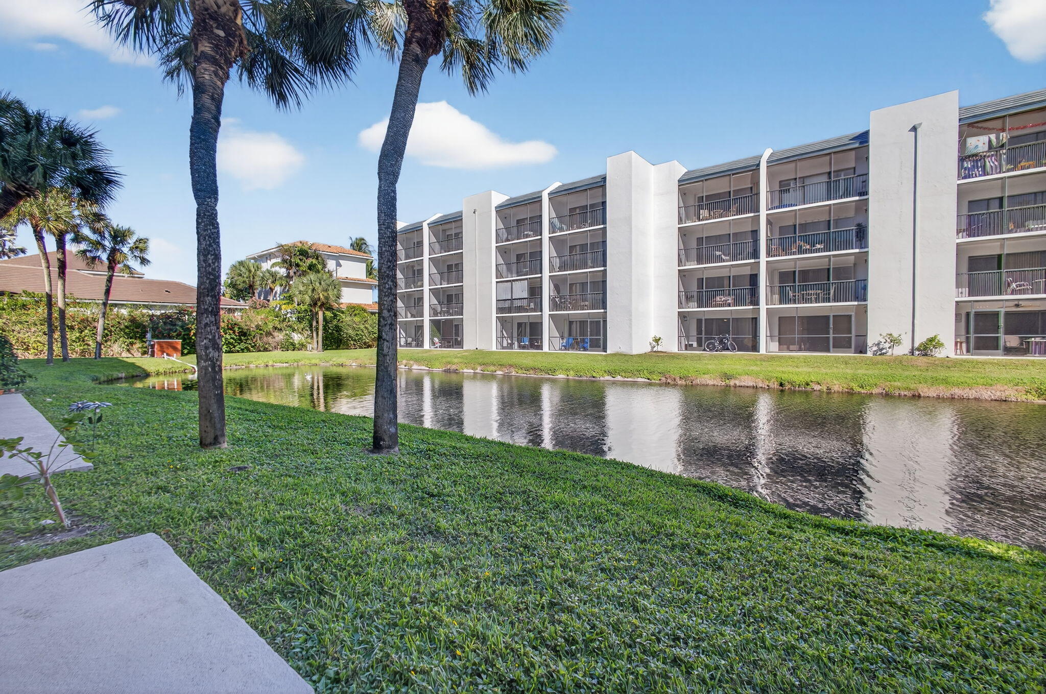 1605 Highway 1, Unit D105 Jupiter, FL 33477 - Photo 35 of 69 front view of a house with a yard