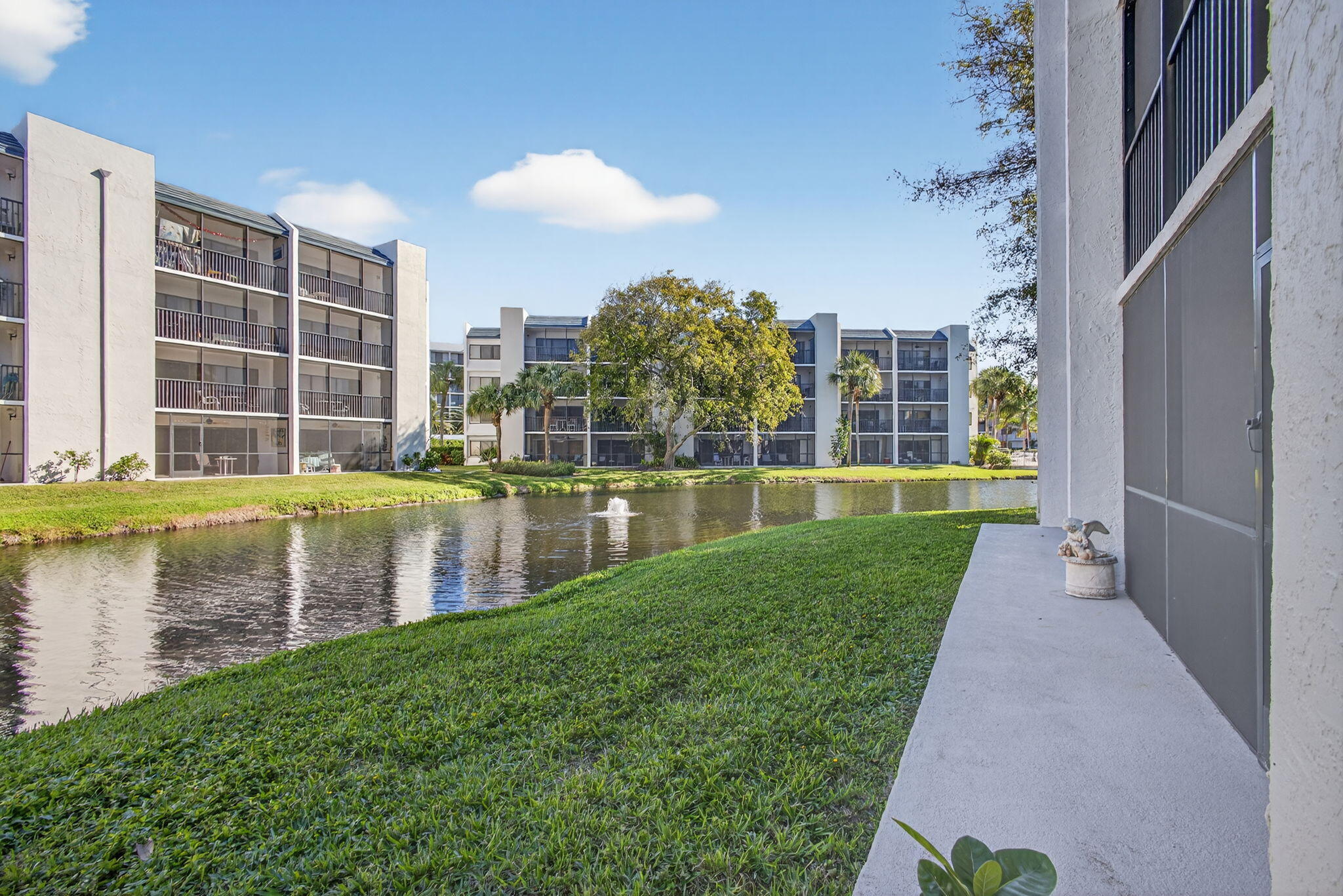 1605 Highway 1, Unit D105 Jupiter, FL 33477 - Photo 39 of 69 a view of a lake with a building in the background