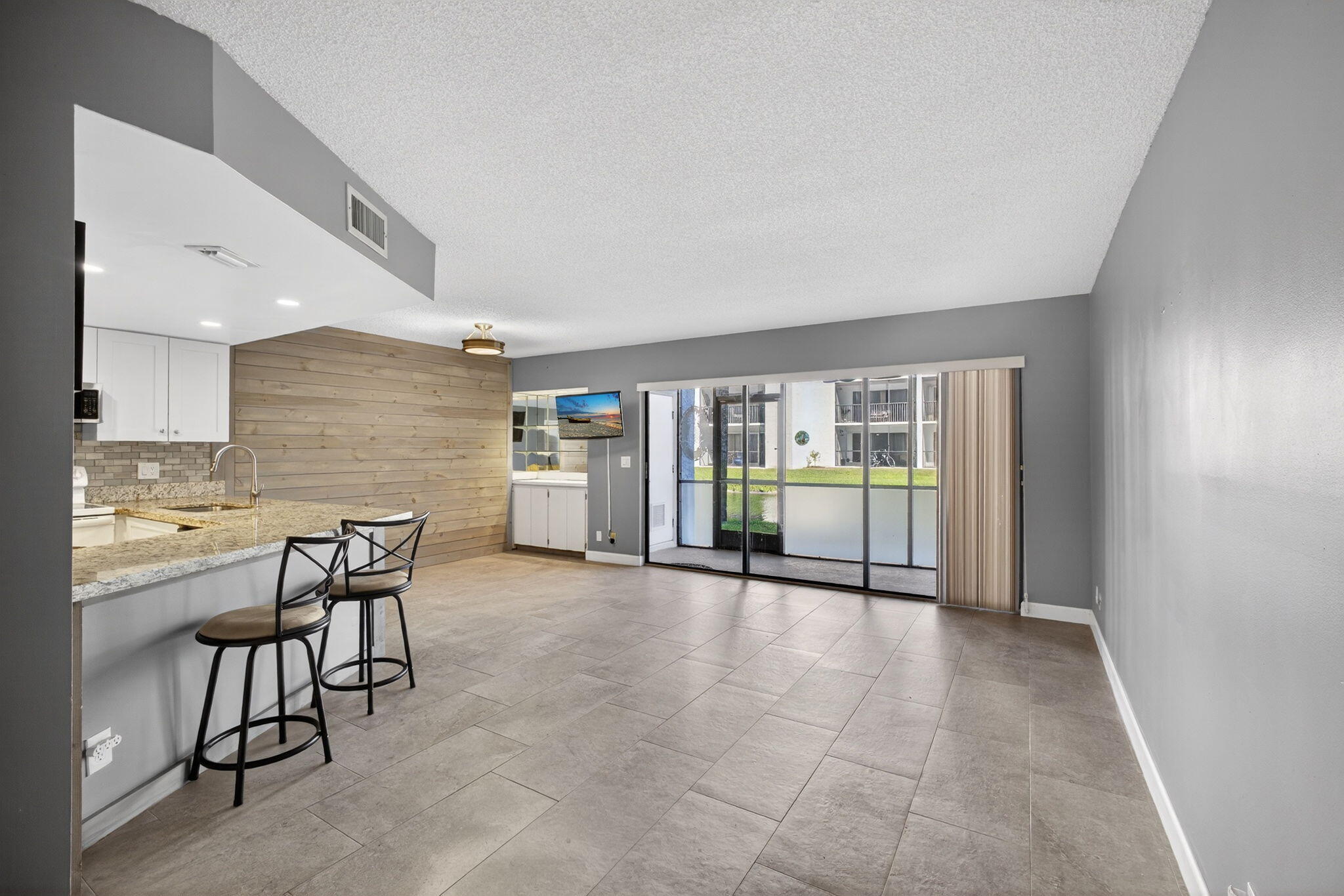 1605 Highway 1, Unit D105 Jupiter, FL 33477 - Photo 4 of 69 a view of a livingroom with furniture window and outside view