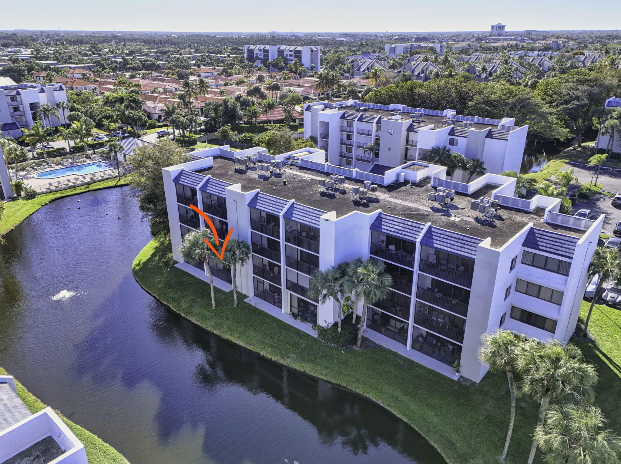 1605 Highway 1, Unit D105 Jupiter, FL 33477 - Photo 49 of 69 a aerial view of a house with a big yard plants and large trees