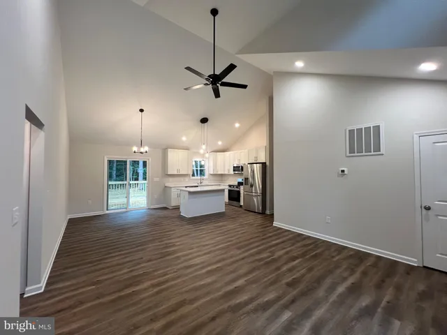 a kitchen with stainless steel appliances a refrigerator sink and cabinets