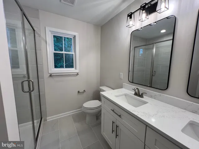 a utility room with sink dryer and washer