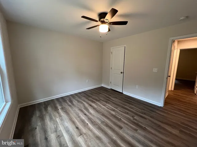 a bathroom with sink a mirror and a toilet