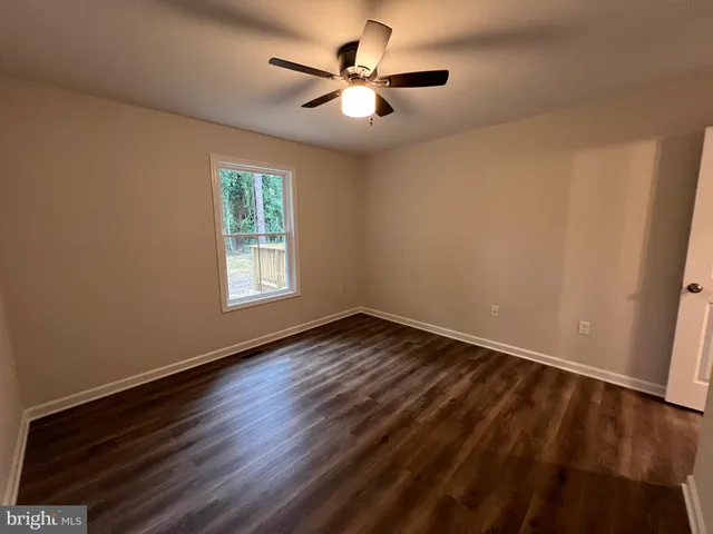 a view of a livingroom with wooden floor