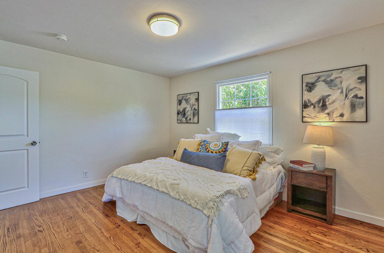 1815 King Street Santa Cruz, CA 95060 - Photo 17 of 36 a bedroom with a bed and wooden floor