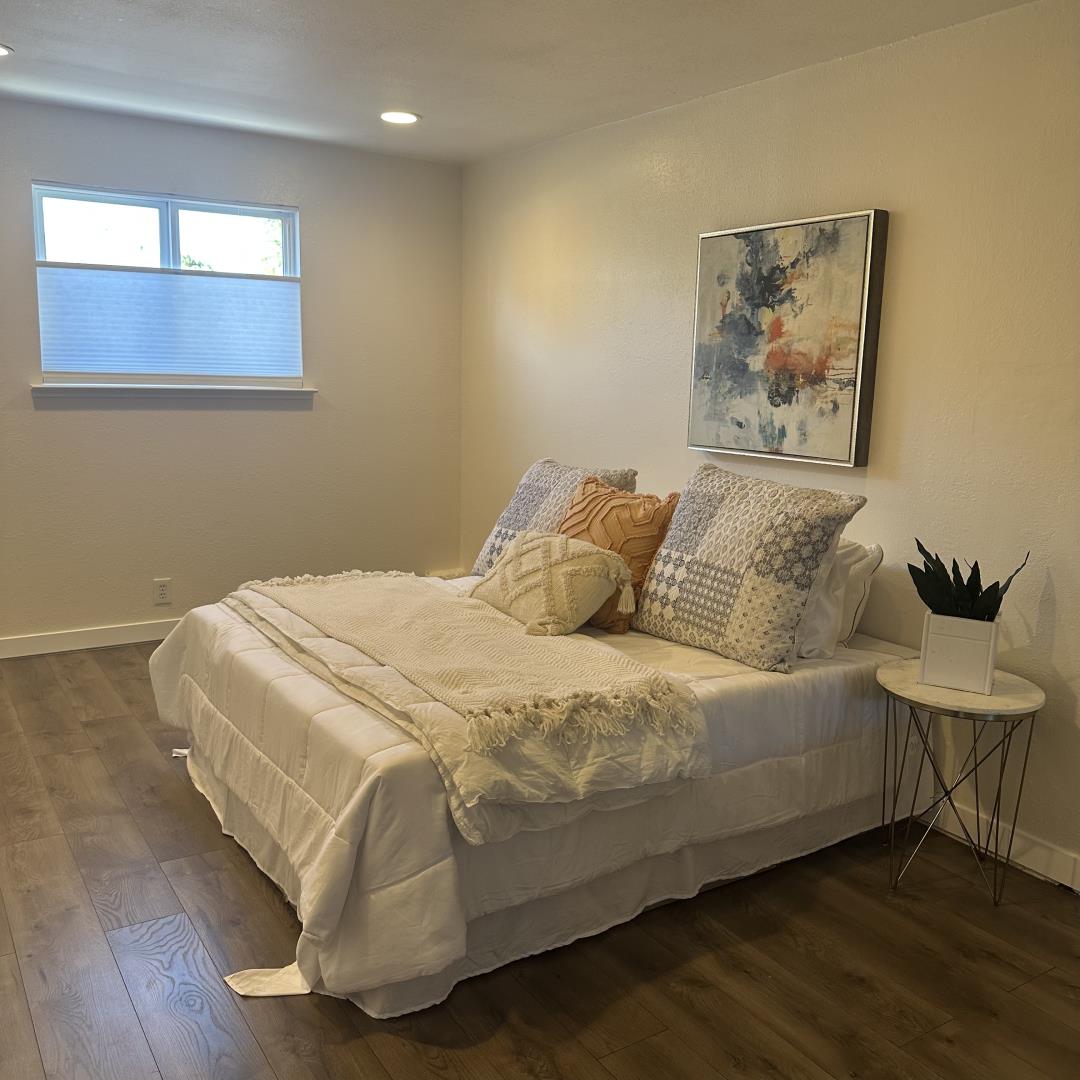 1815 King Street Santa Cruz, CA 95060 - Photo 21 of 36 a large bed sitting in a bedroom next to a window