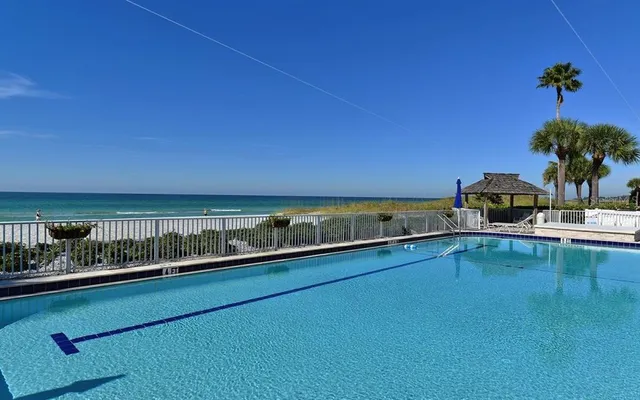 a view of a swimming pool with a chair