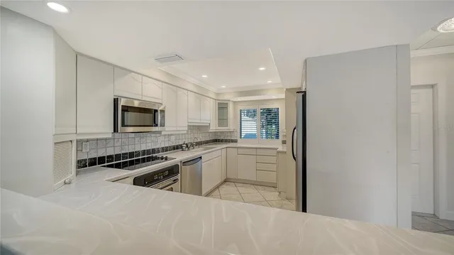 a kitchen with a stove and a microwave