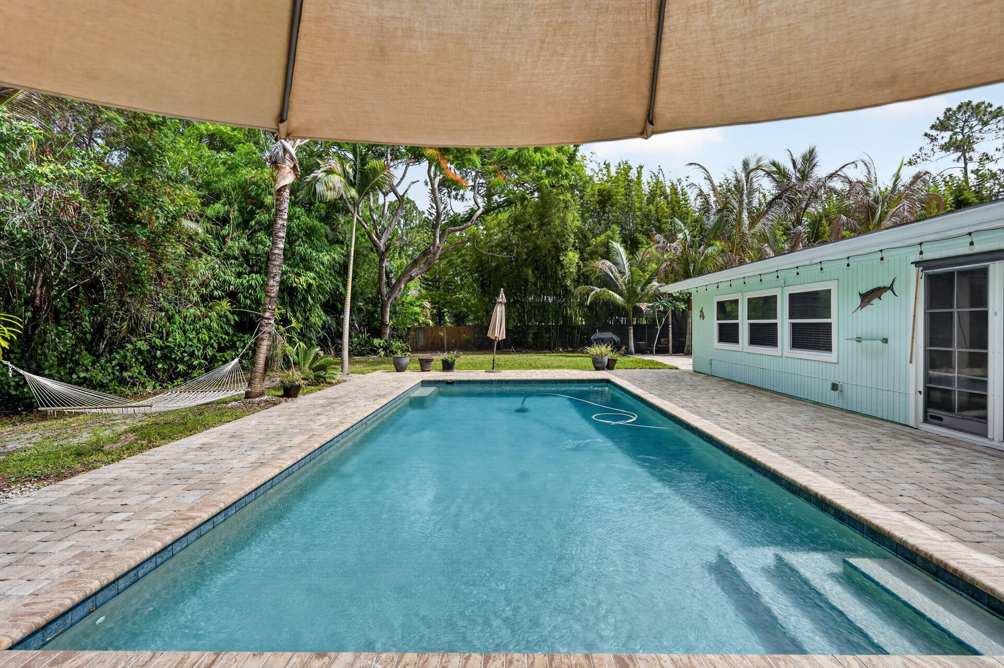17391 Alexander Run Jupiter, FL 33478 - Photo 37 of 55 a view of a house with swimming pool