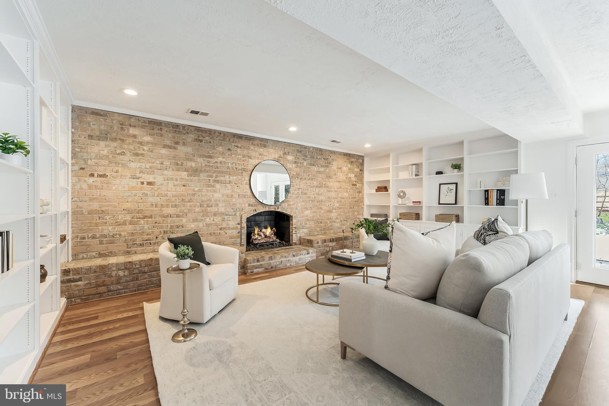 2615 Steeplechase Drive Reston, VA 20191 - Photo 21 of 79 a living room with furniture and a fireplace