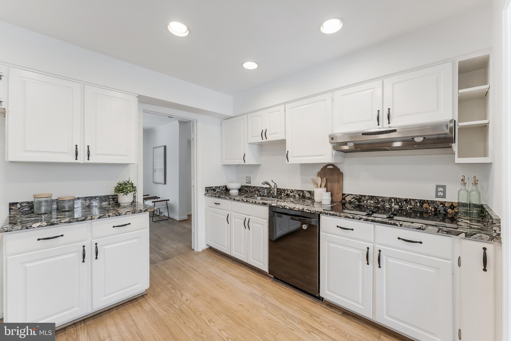 2615 Steeplechase Drive Reston, VA 20191 - Photo 37 of 79 a kitchen with stainless steel appliances granite countertop a stove and a sink