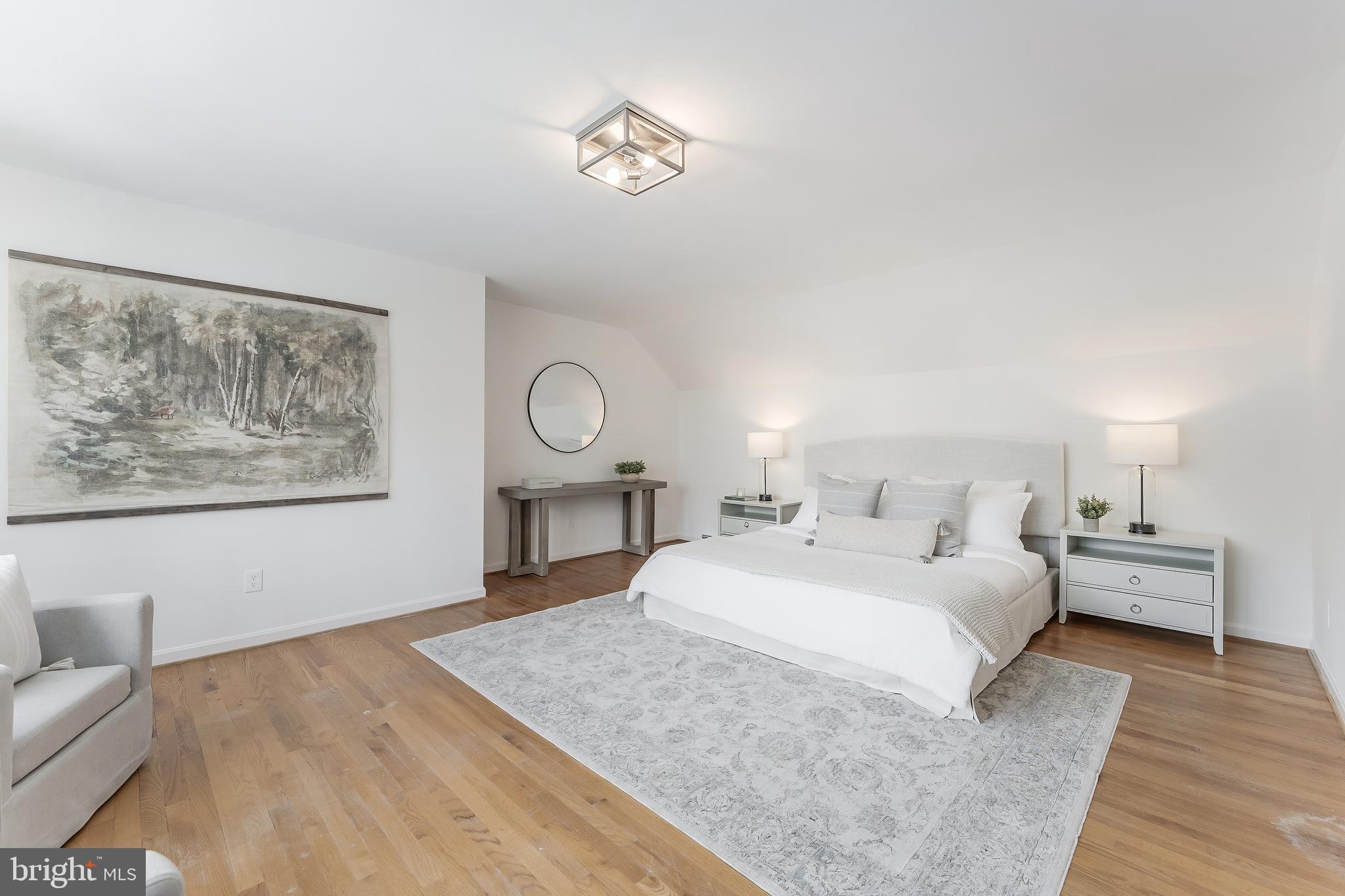 2615 Steeplechase Drive Reston, VA 20191 - Photo 40 of 79 a bedroom with a large bed and a chandelier