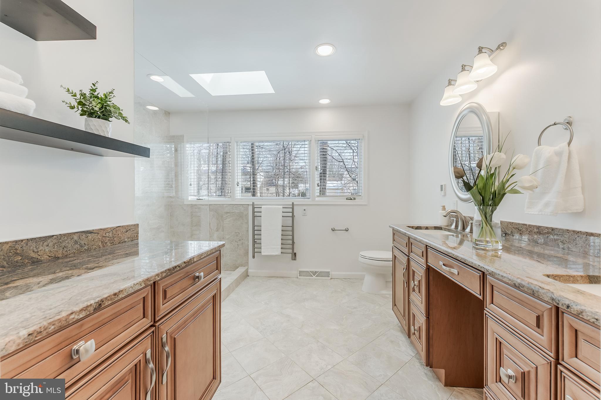 2615 Steeplechase Drive Reston, VA 20191 - Photo 49 of 79 a spacious bathroom with a granite countertop sink a mirror and a