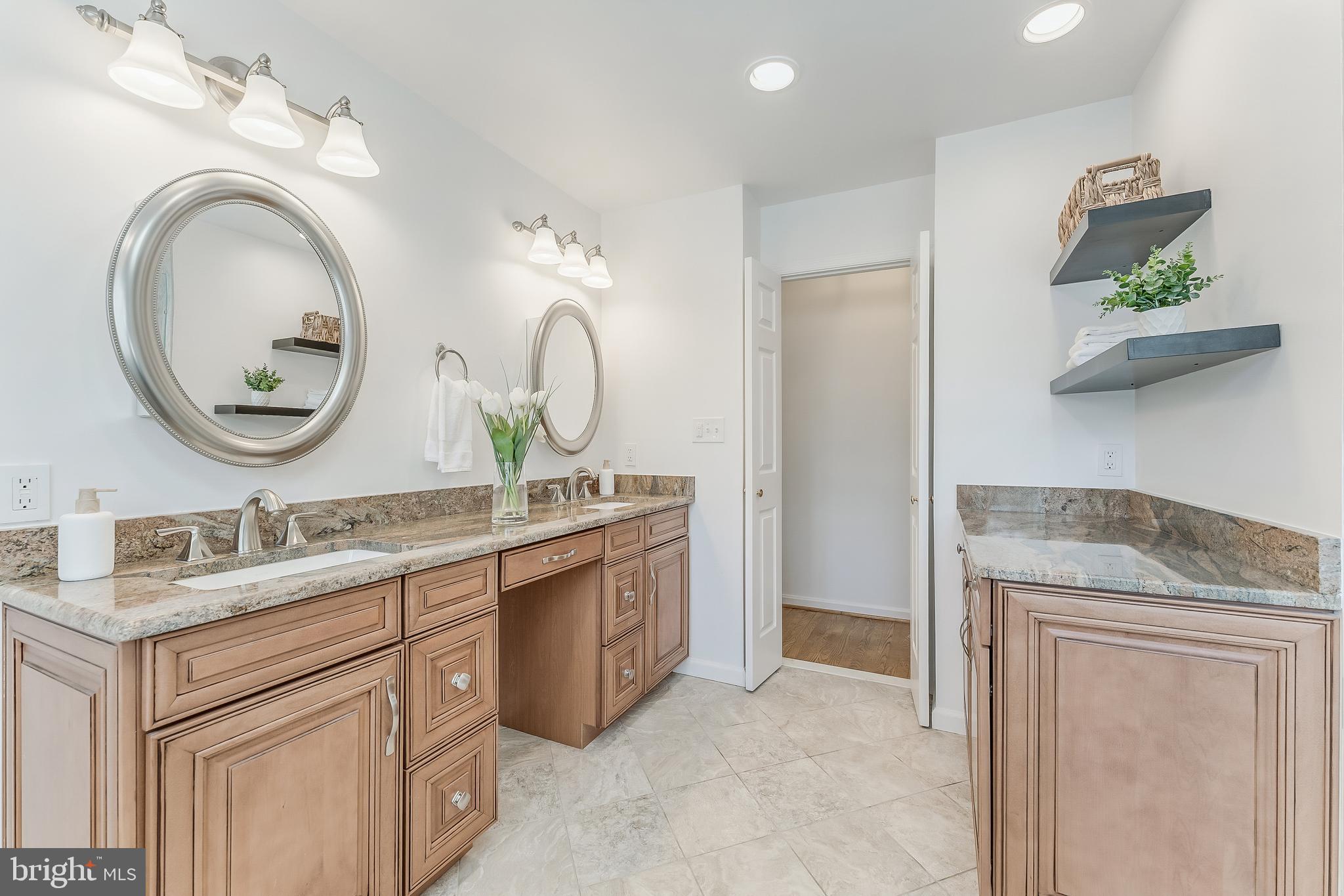 2615 Steeplechase Drive Reston, VA 20191 - Photo 51 of 79 a bathroom with a granite countertop double vanity sink and a mirror
