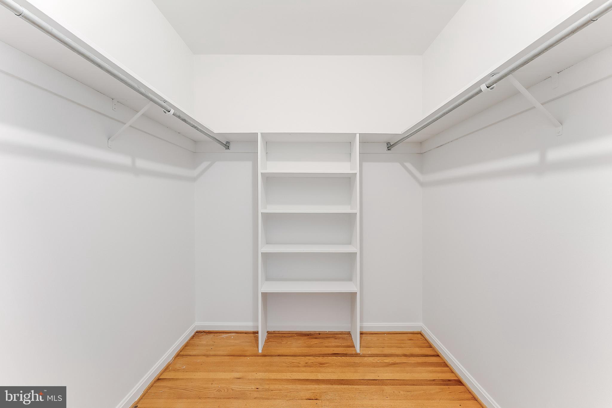 2615 Steeplechase Drive Reston, VA 20191 - Photo 55 of 79 a room with walk in closet and wooden floor