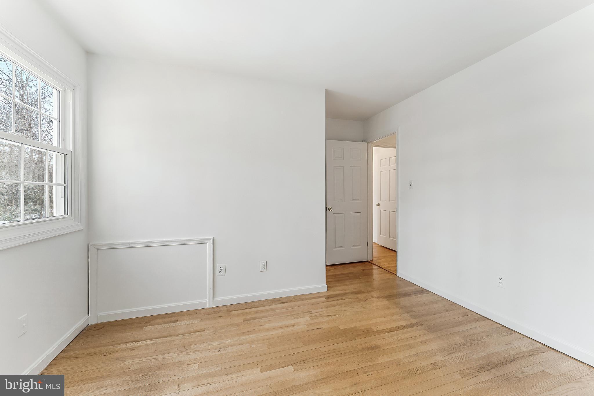 2615 Steeplechase Drive Reston, VA 20191 - Photo 57 of 79 a view of an empty room with wooden floor and a window