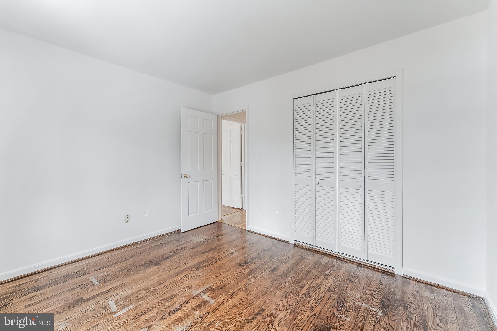 2615 Steeplechase Drive Reston, VA 20191 - Photo 60 of 79 a view of an empty room with wooden floor