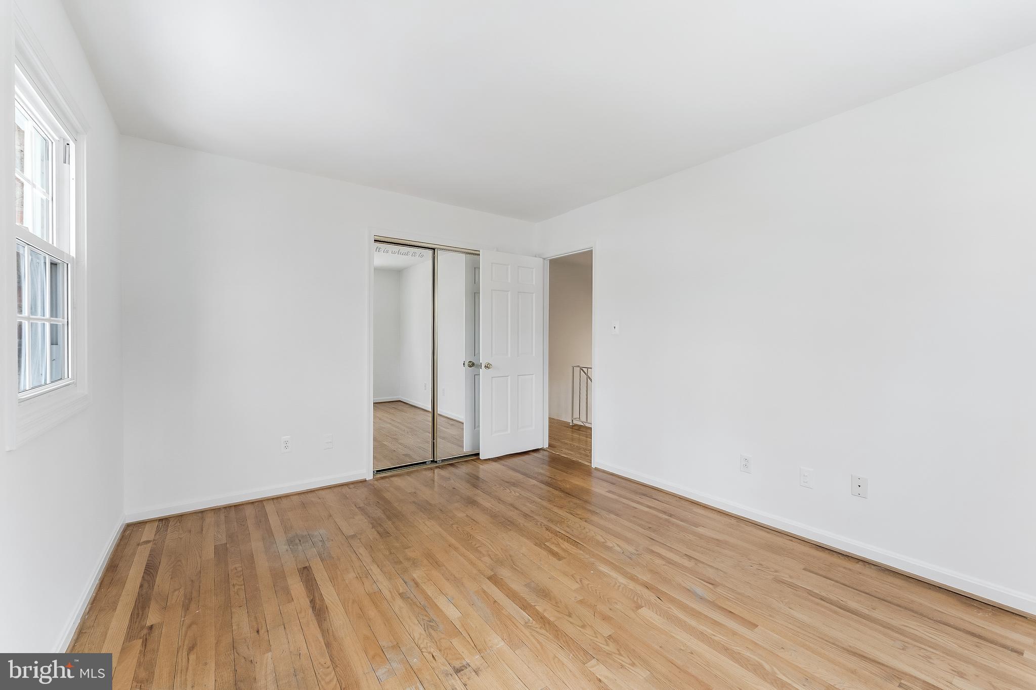 2615 Steeplechase Drive Reston, VA 20191 - Photo 62 of 79 a view of an empty room with wooden floor and a window