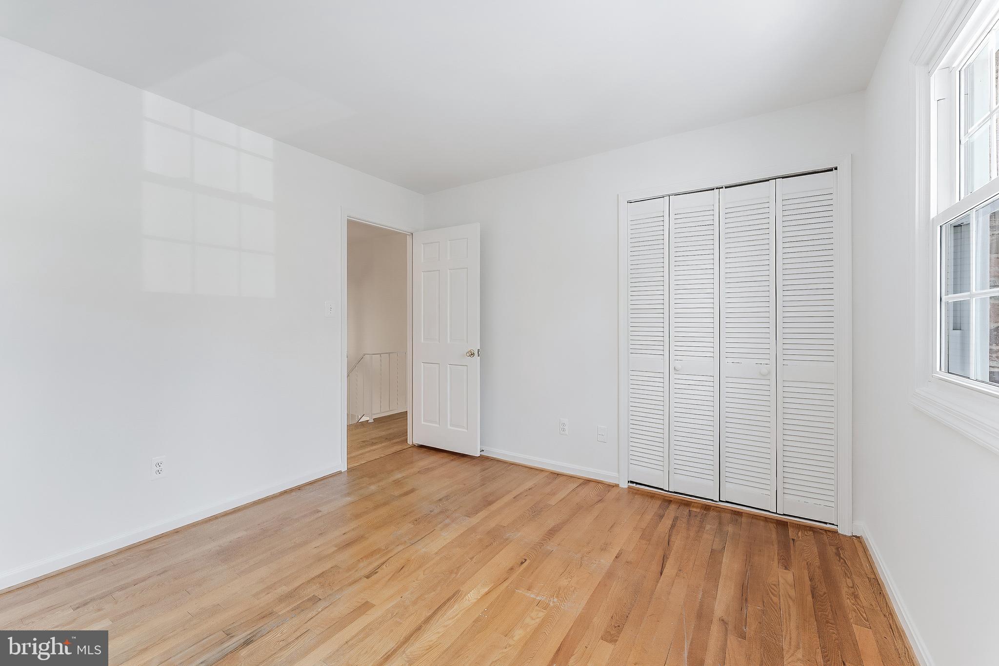 2615 Steeplechase Drive Reston, VA 20191 - Photo 65 of 79 an empty room with wooden floor and windows