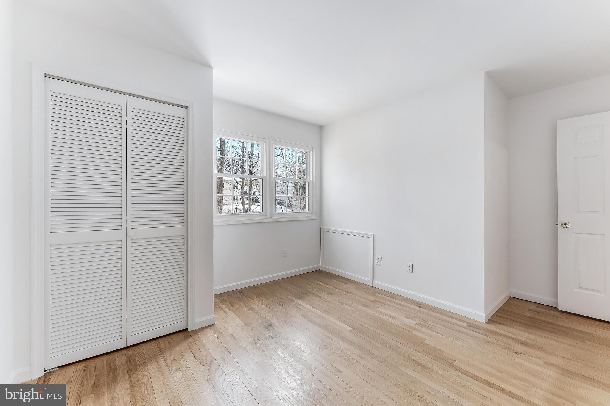 2615 Steeplechase Drive Reston, VA 20191 - Photo 68 of 79 an empty room with wooden floor and windows