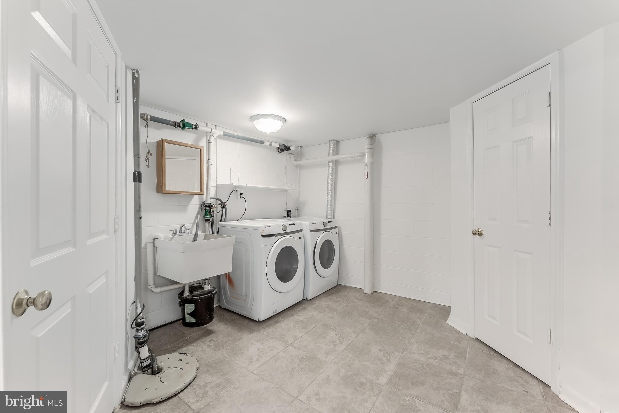 2615 Steeplechase Drive Reston, VA 20191 - Photo 75 of 79 a view of a storage & utility room with washer and dryer
