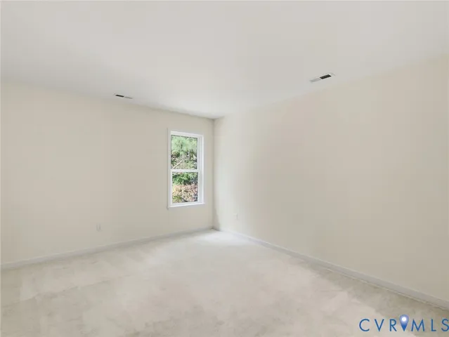 a view of an empty room and entryway