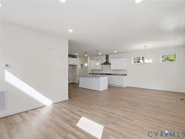 a view of kitchen with wooden floor