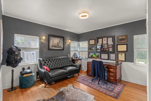a living room with couch and a window